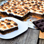 Easy way to enjoy all the goodness of s'mores from your kitchen! Golden-brown-slightly-charred marshmallows melt over rich chocolate ganache.