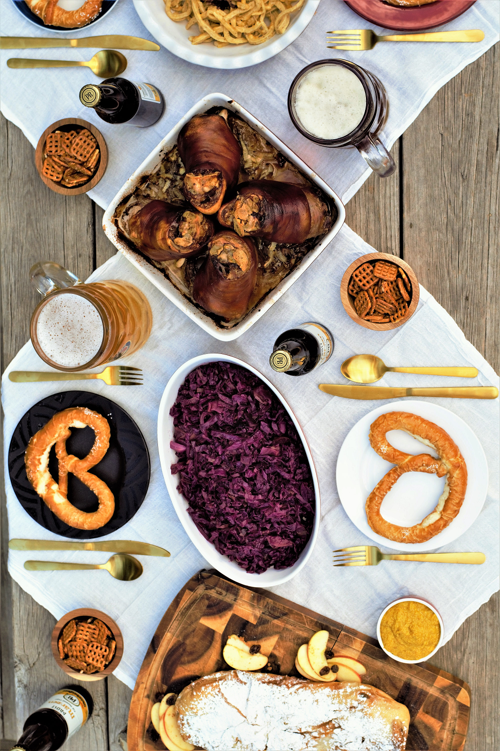 All-in-one guide for hosting your own Oktoberfest feast: roasted pork knuckle, sweet-tart red cabbage, cheesy noodle dumplings, & flaky apple strudel!
