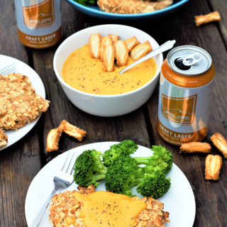 Celebrating the love triangle of beer-pretzels-cheese: pretzel-breaded chicken baked to crispy perfection + drizzled with velvety smooth beer cheese!