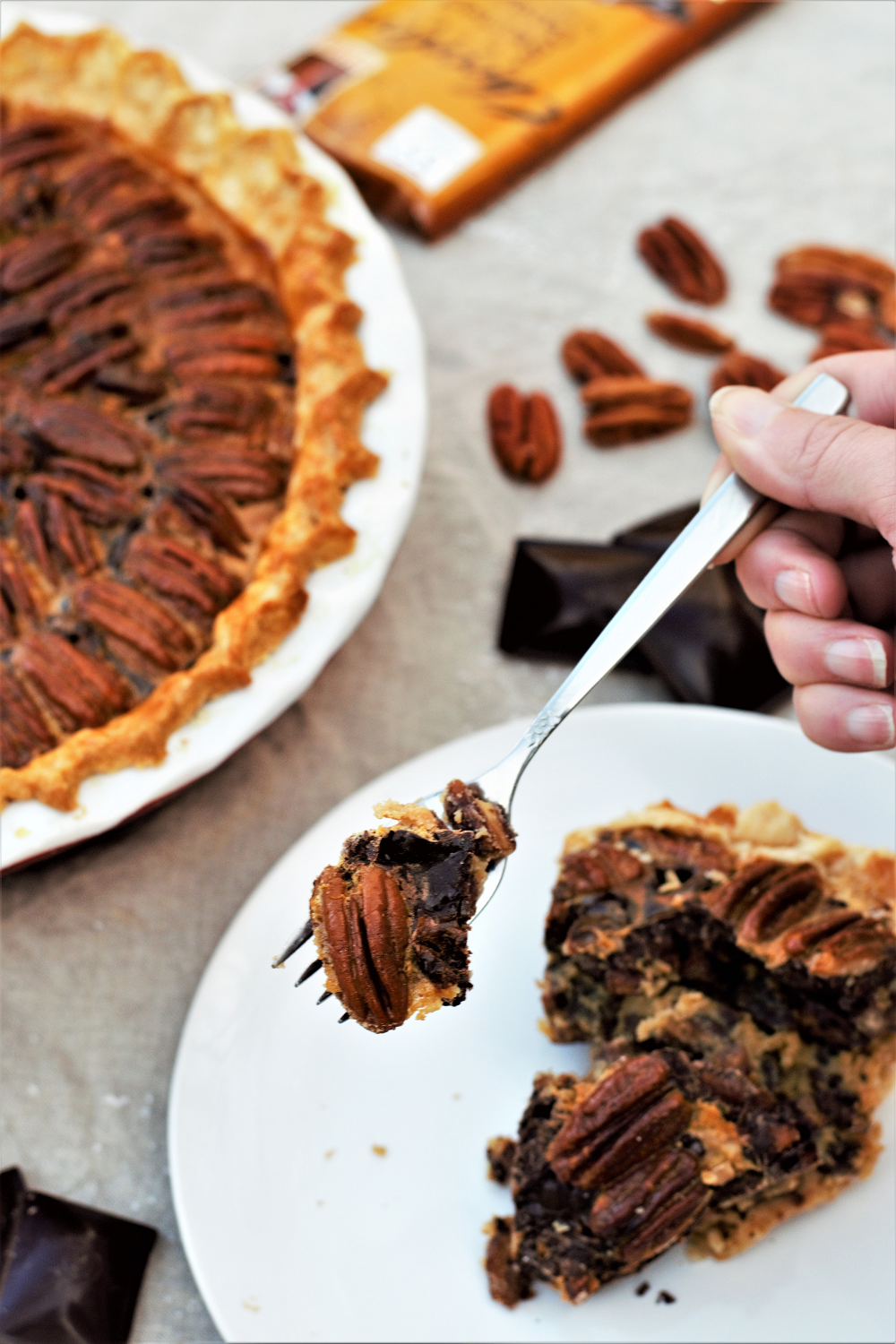 Toasted pecans, salted caramel, and rich dark chocolate layered inside a perfectly flaky pie crust for a new twist on a holiday favorite!