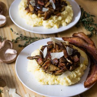 Mushrooms + bacon + parmesan over creamy goat cheese polenta are a powerhouse of flavor! Don't limit carbonara only to pasta - this is the perfect way to wrap up winter comfort food.