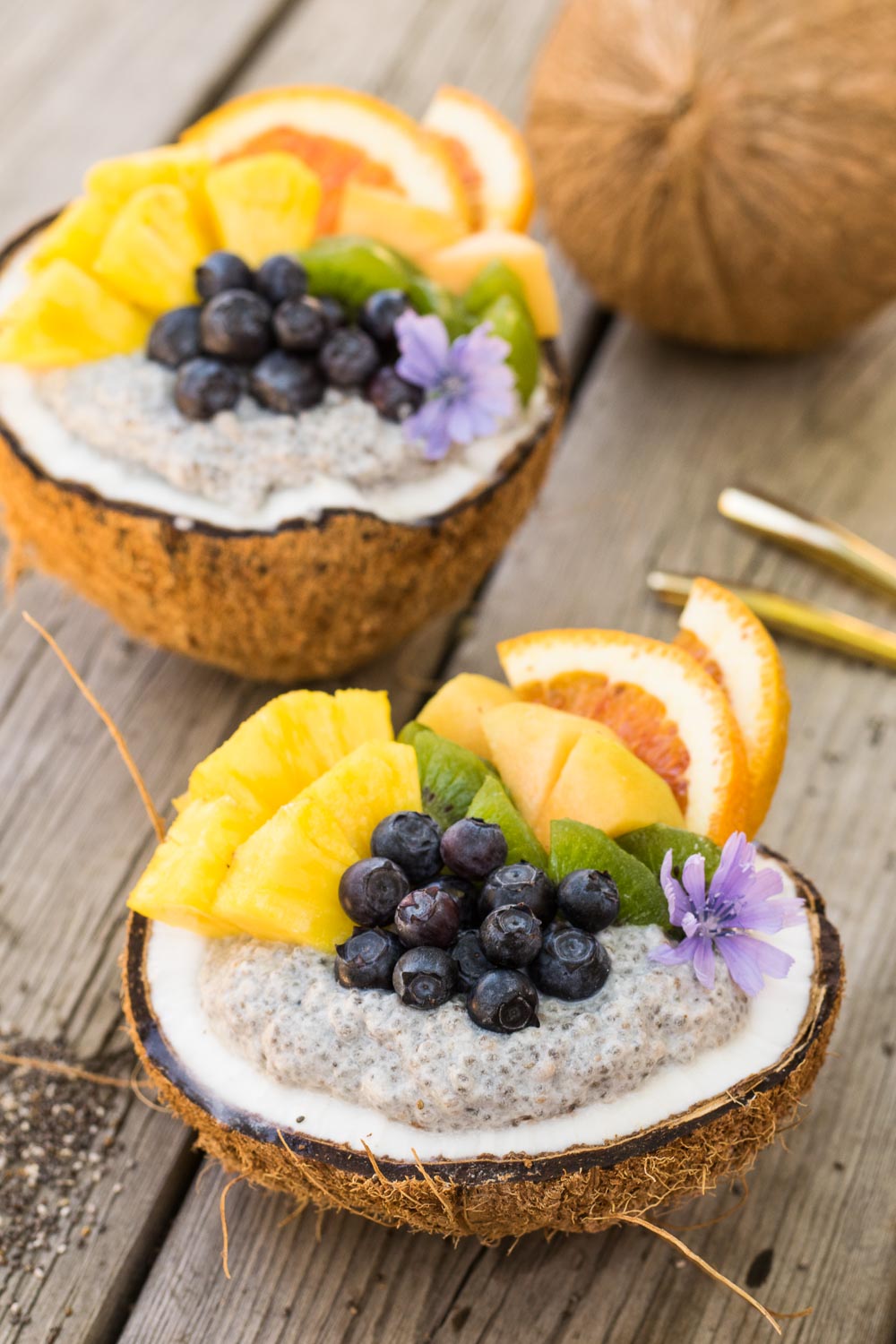 Naturally sweet overnight chia bowls loaded with coconut & your favorite fruit! Freshly cracked coconut bowls take this breakfast from weekday to weekend.