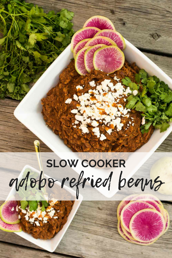 Adding smoky, spicy chipotle adobo peppers to homemade refried beans, because we deserve it! And making it all in the slow cooker, because we can.