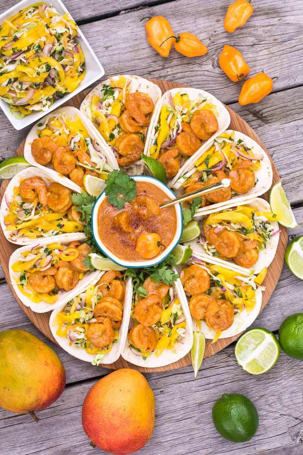 Spicy-sweet-crunchy-soft shrimp tacos are our summer anthem! Perfect excuse to marry Indian & Mexican with the bright, peppy flavors of mango & habanero.