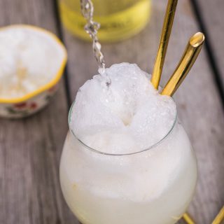 Enjoy the dog days of summer with a deliciously bubbly, wonderfully refreshing frozen treat of tart sherbet melting into sweet lemon liqueur! #limoncello #seltzer #dessert | mountaincravings.com