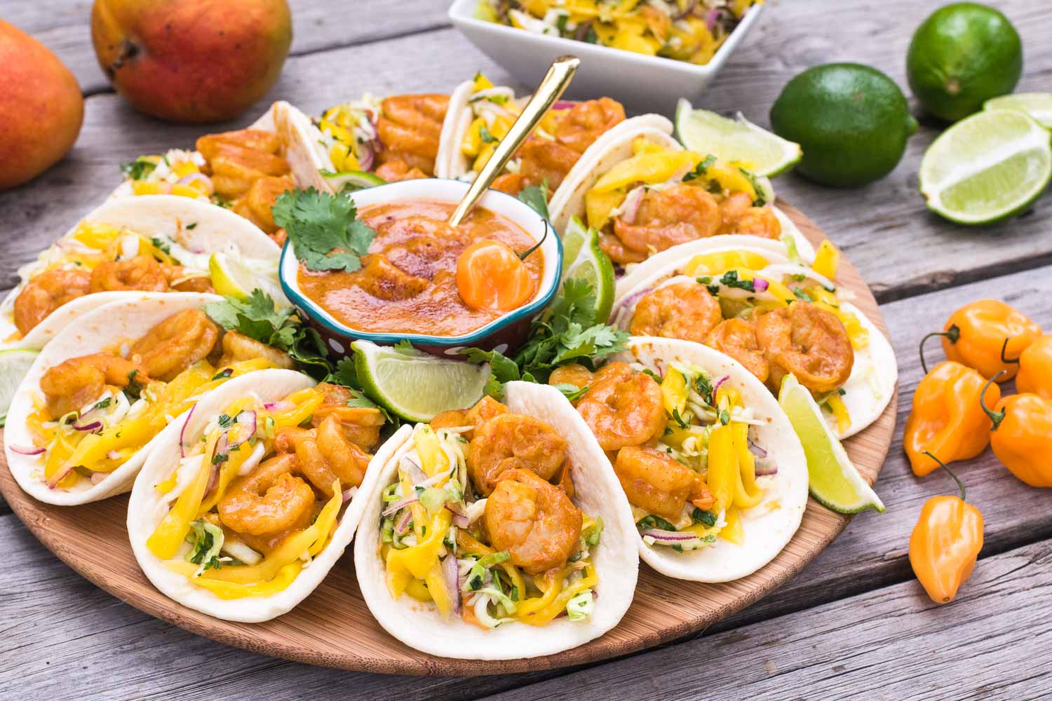 Spicy-sweet-crunchy-soft shrimp tacos are our summer anthem! Perfect excuse to marry Indian & Mexican with the bright, peppy flavors of mango & habanero.