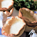 There's nothing better than naan bowls filled with hot curry - breaking off the edges to dunk in creamy, rich sauce is the perfect way to enjoy both dishes!